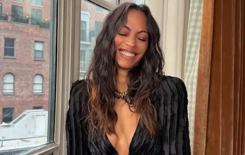 Zoe Saldaña Turns Heads at “Lioness” Season 3 Premiere in Daring Plunging Black Balmain Dress